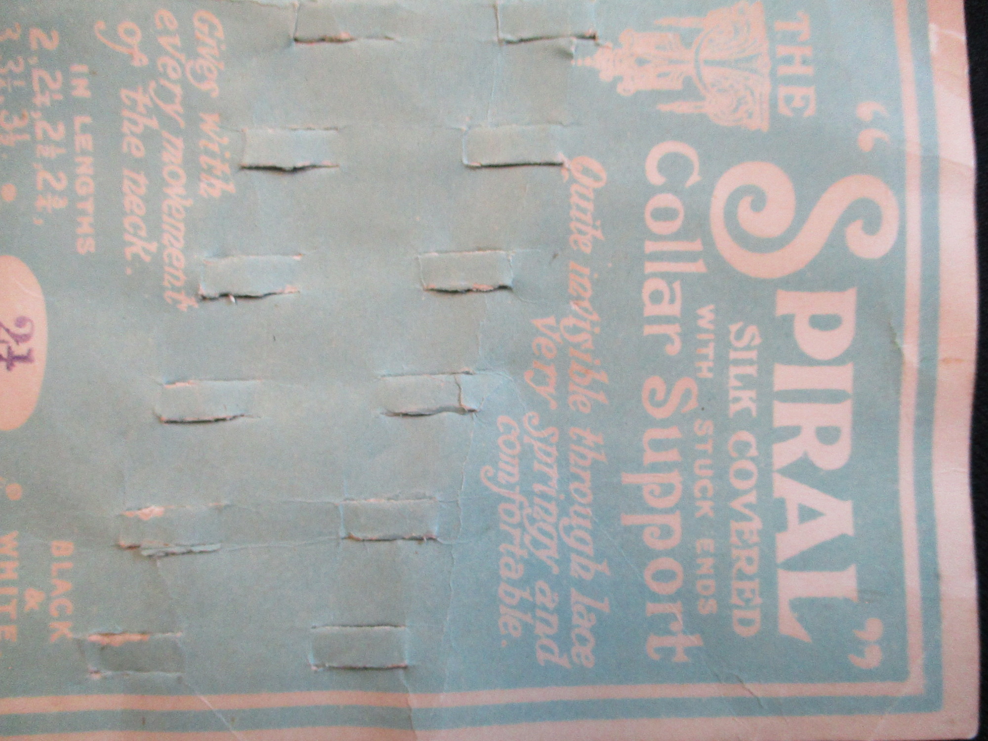 Card to display a collar support: Close view of collar support display card. - front top