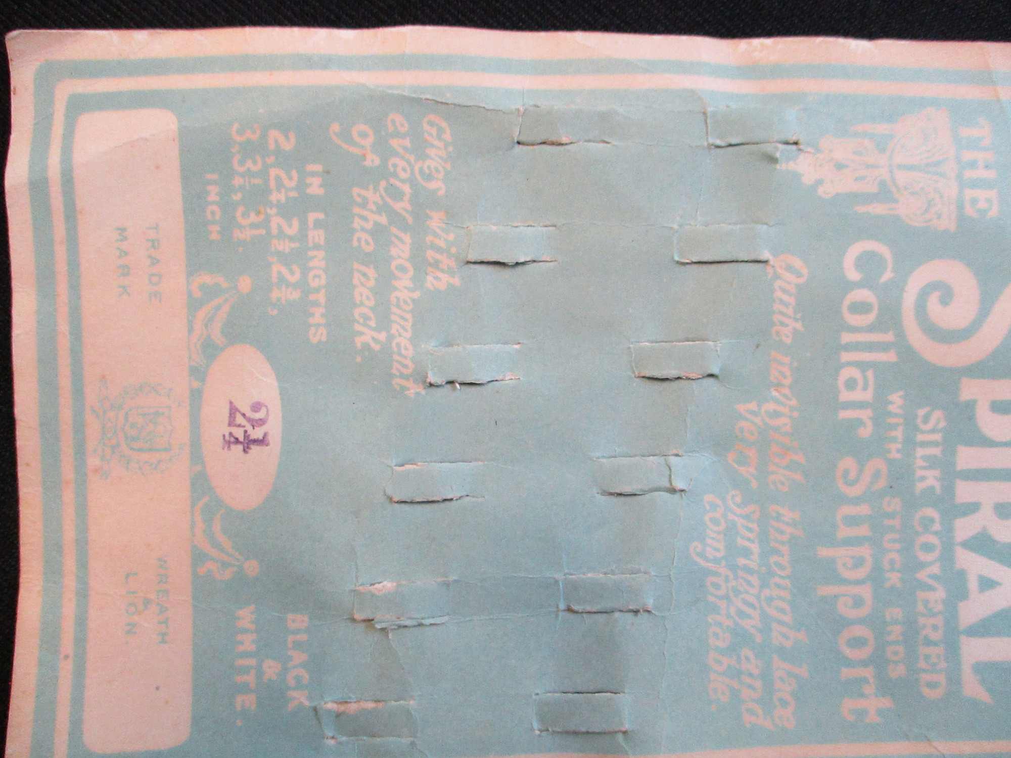 Card to display a collar support: Close view of collar support display card. - front bottom