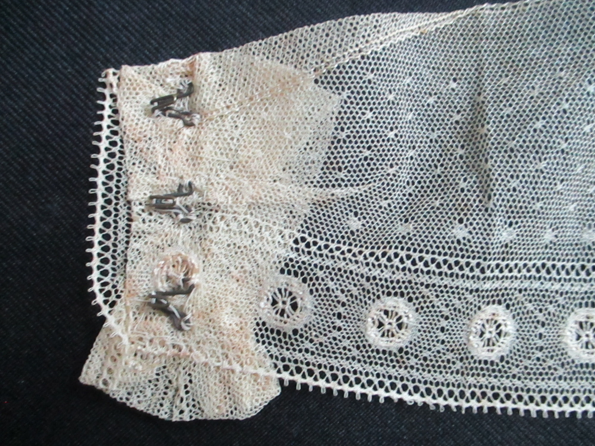 Child's cream collar.: Hook fastening on child's handmade cream collar.(i)