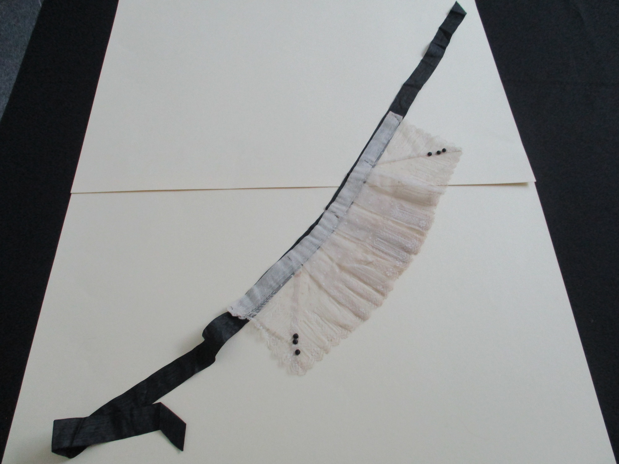 Cream lace collar.: Cream lace collar on black satin ribbon.