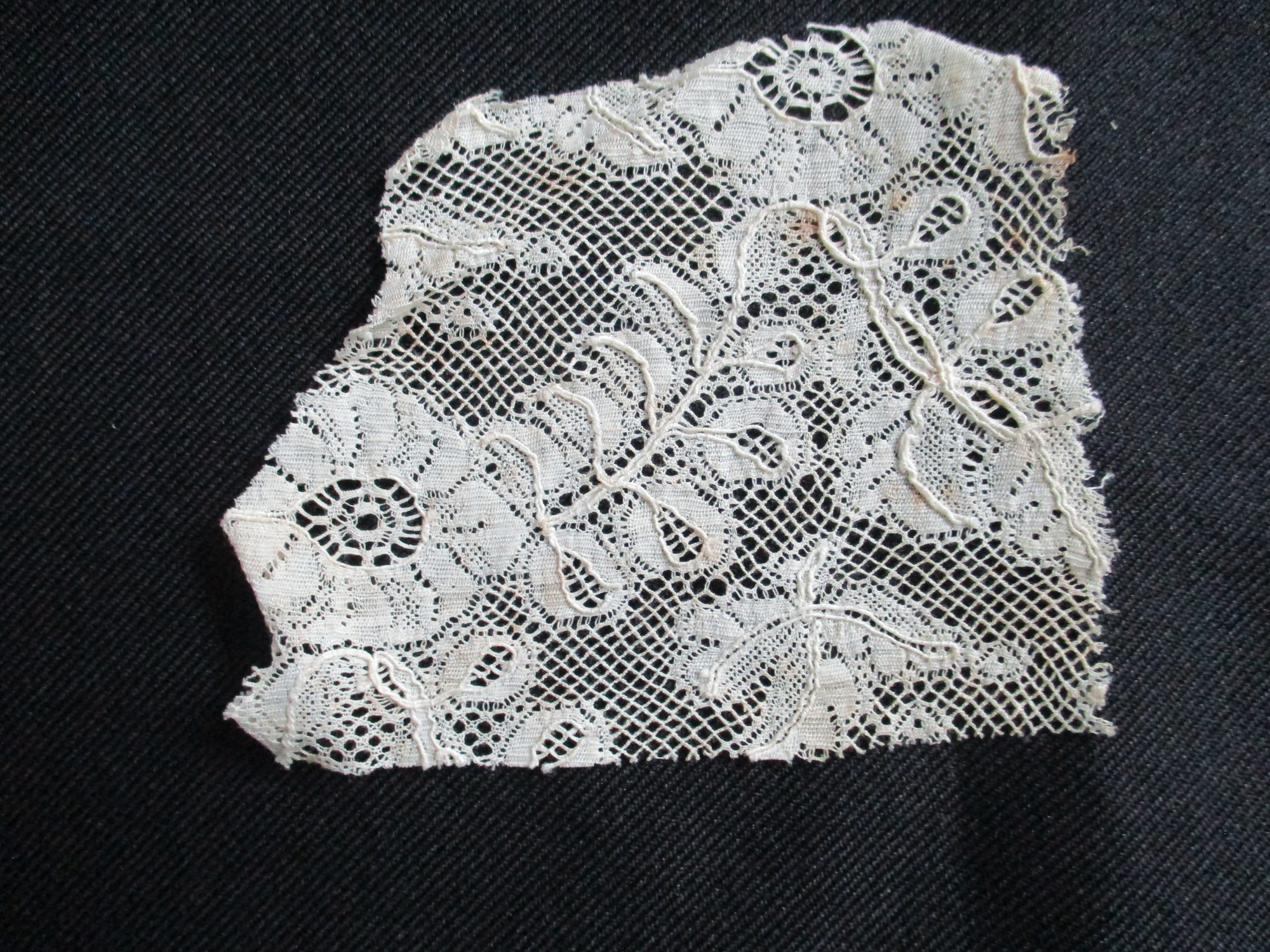 Four pieces of cream lace.: Small piece of cream silk lace.