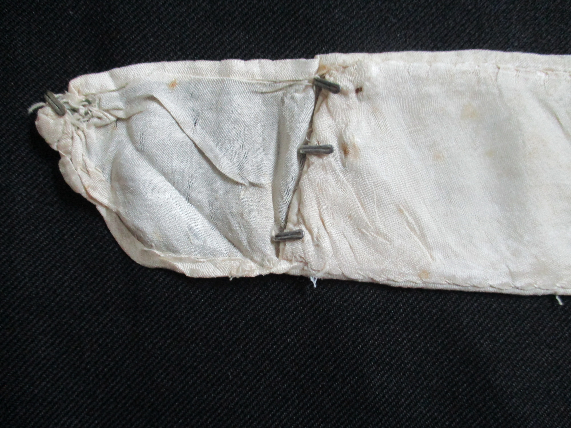 Lace Collar: Close up of hooks attached to collar interface.