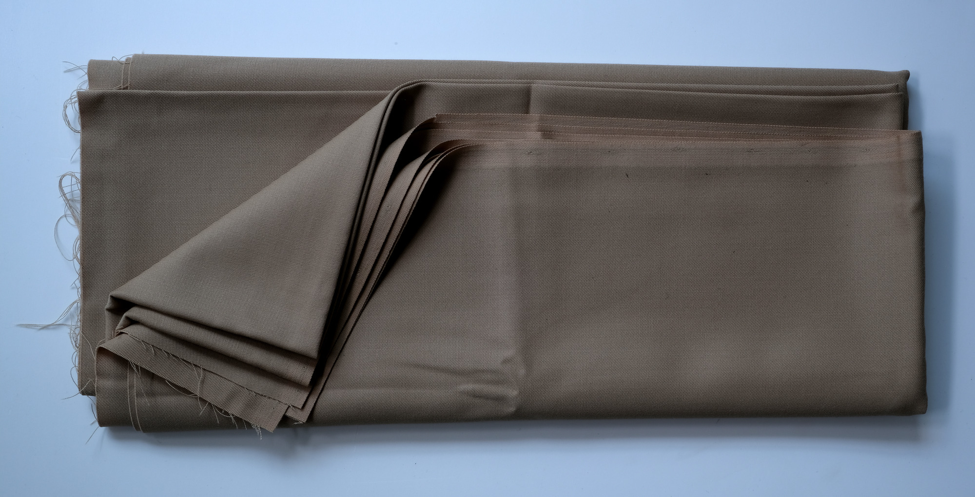 Length of beige cloth: View showing cloth folded back twice