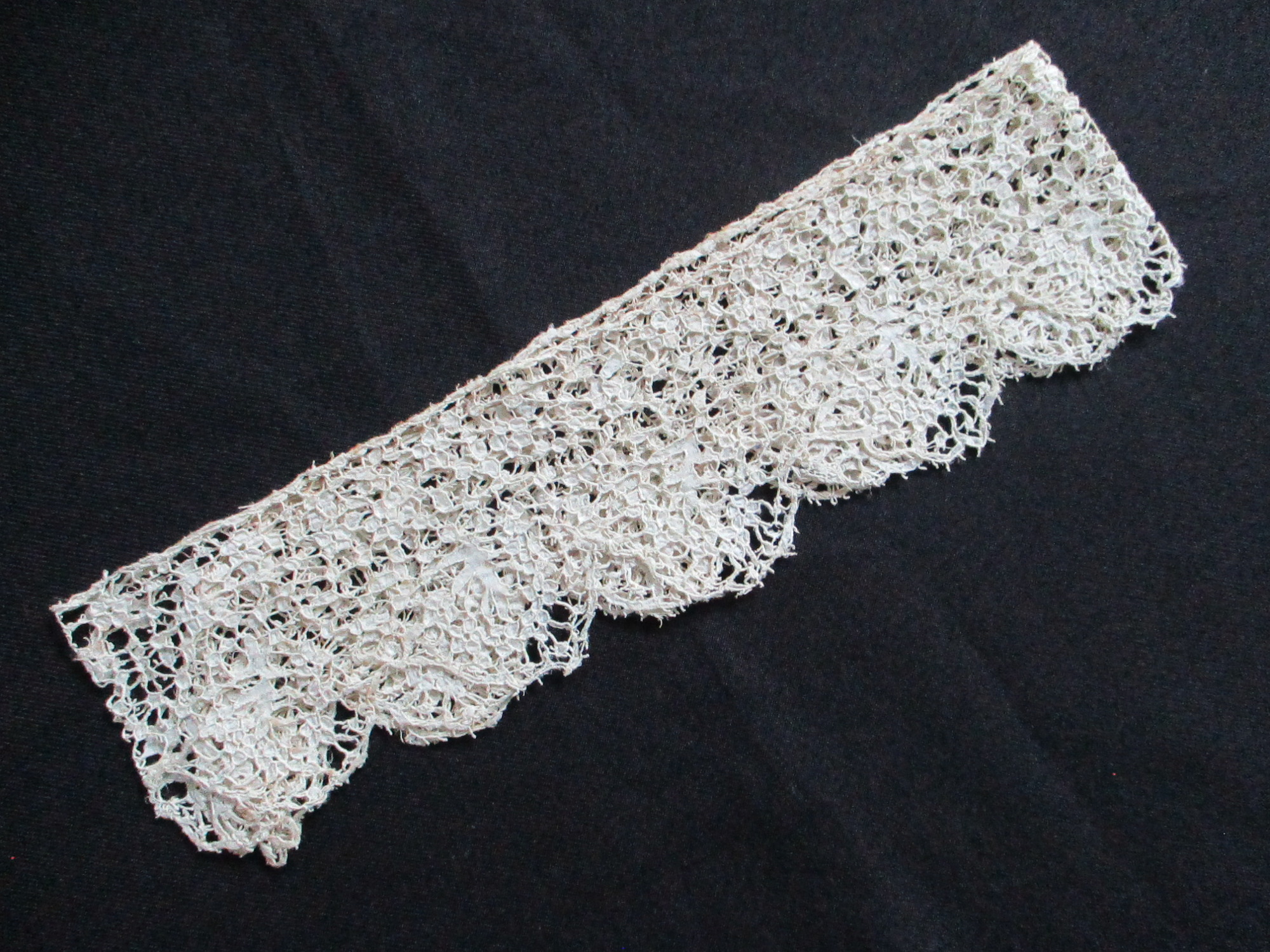 Length of cream silk lace.