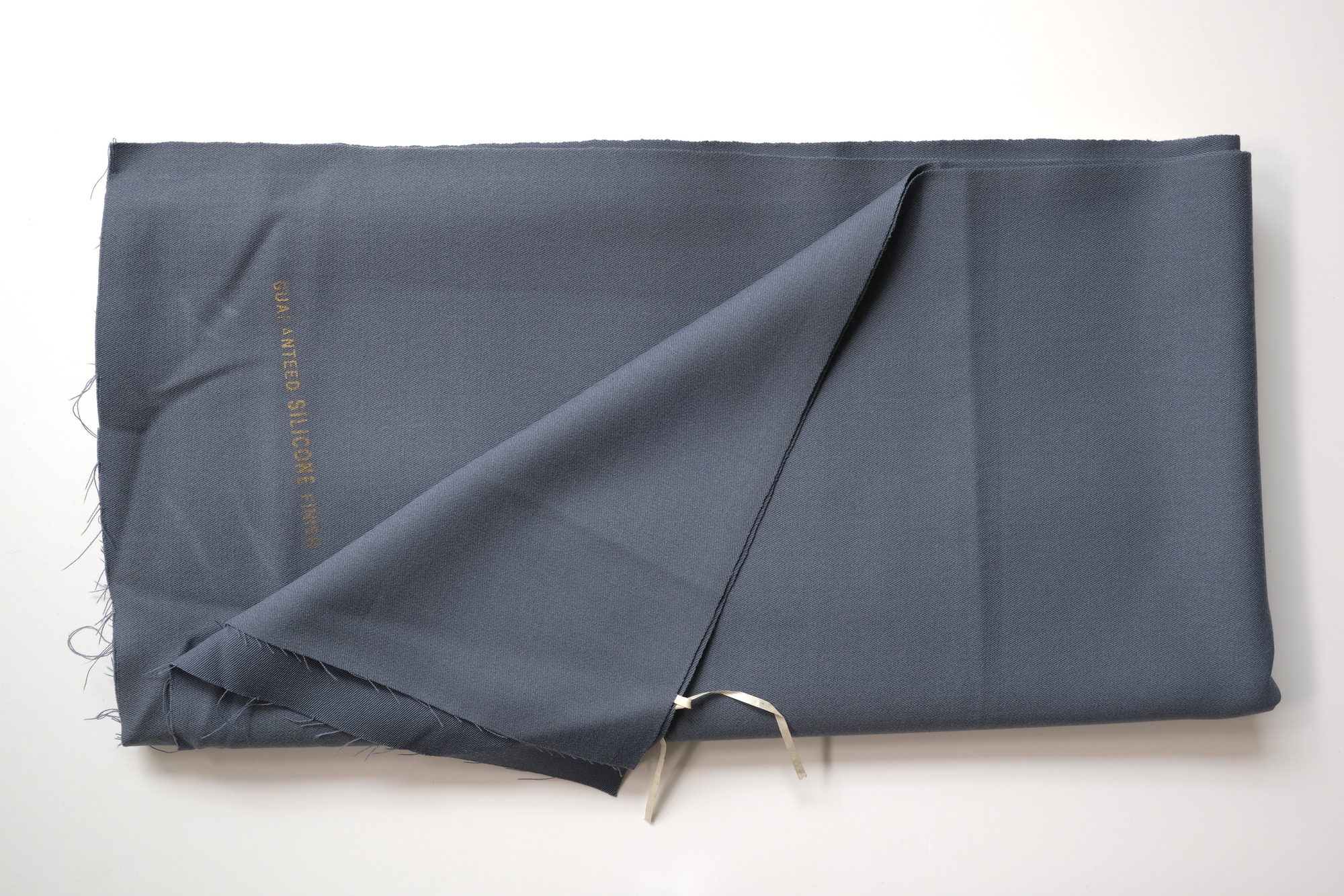 Length of grey cloth: View showing cloth folded back once