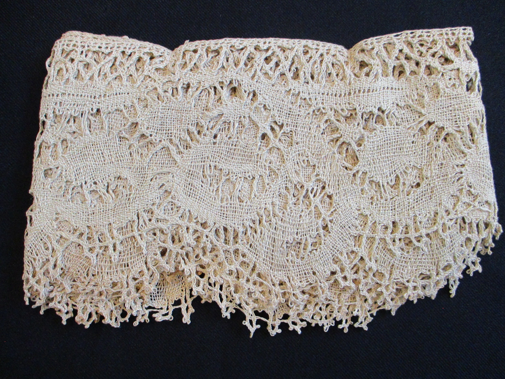Length of Italian lace with sales ticket.: Folded length of Italian lace.