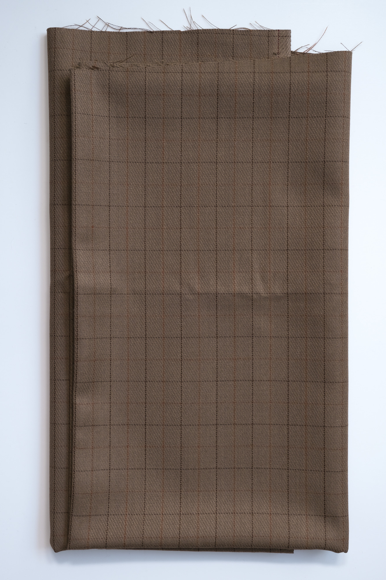 Length of light-brown slight-check cloth