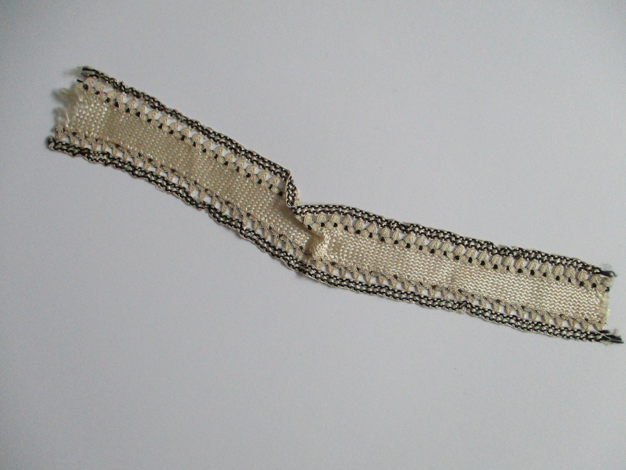 Length of silk ribbon/trim.