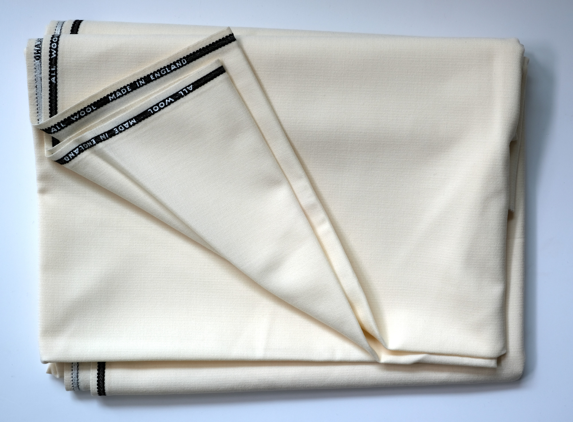 Length of white cloth: View showing cloth folded back twice
