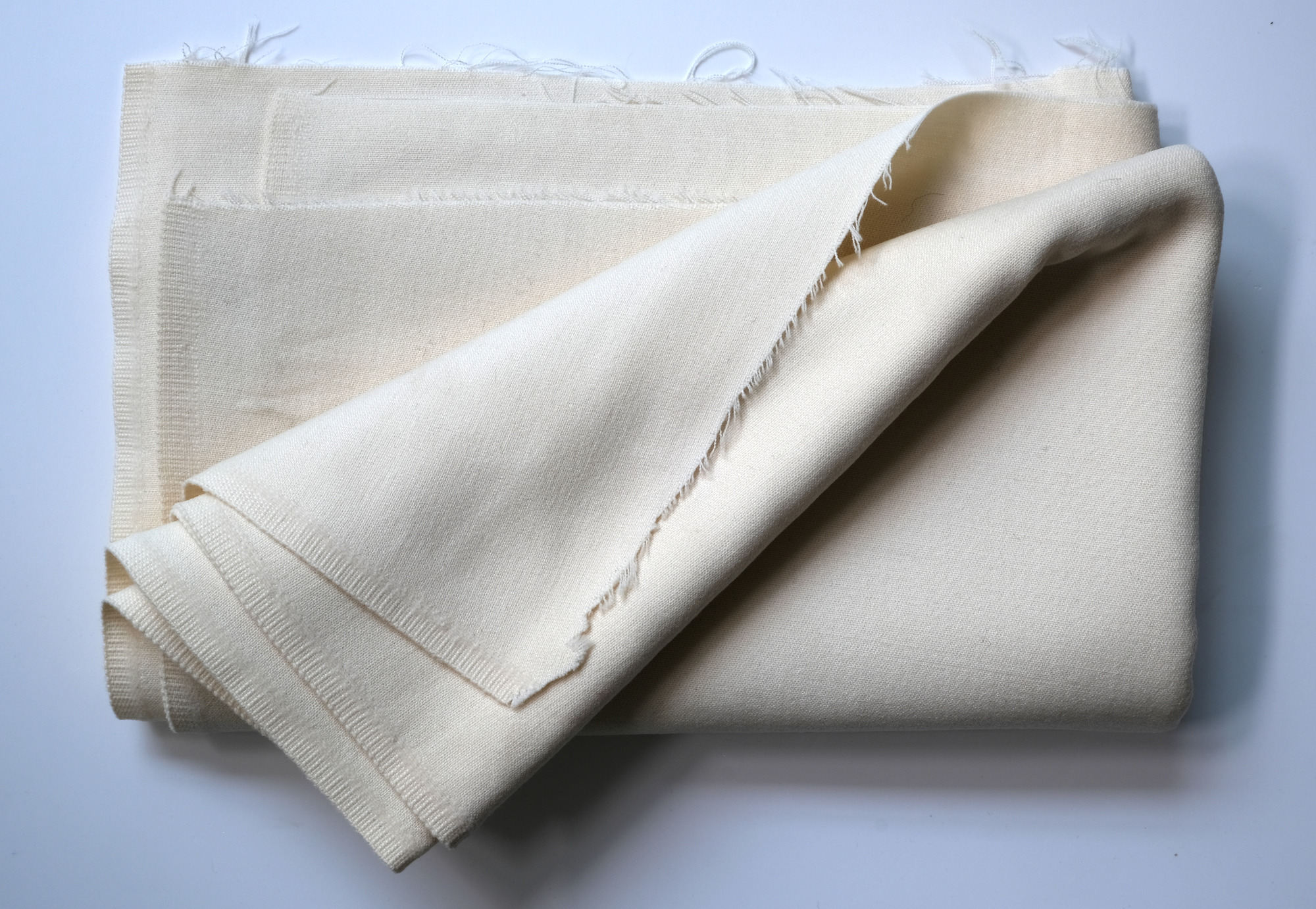 Length of white cloth: View showing cloth folded back twice