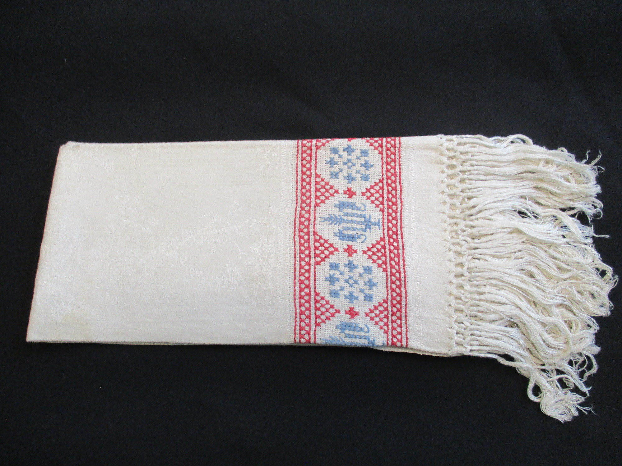 One embroidered damask towel