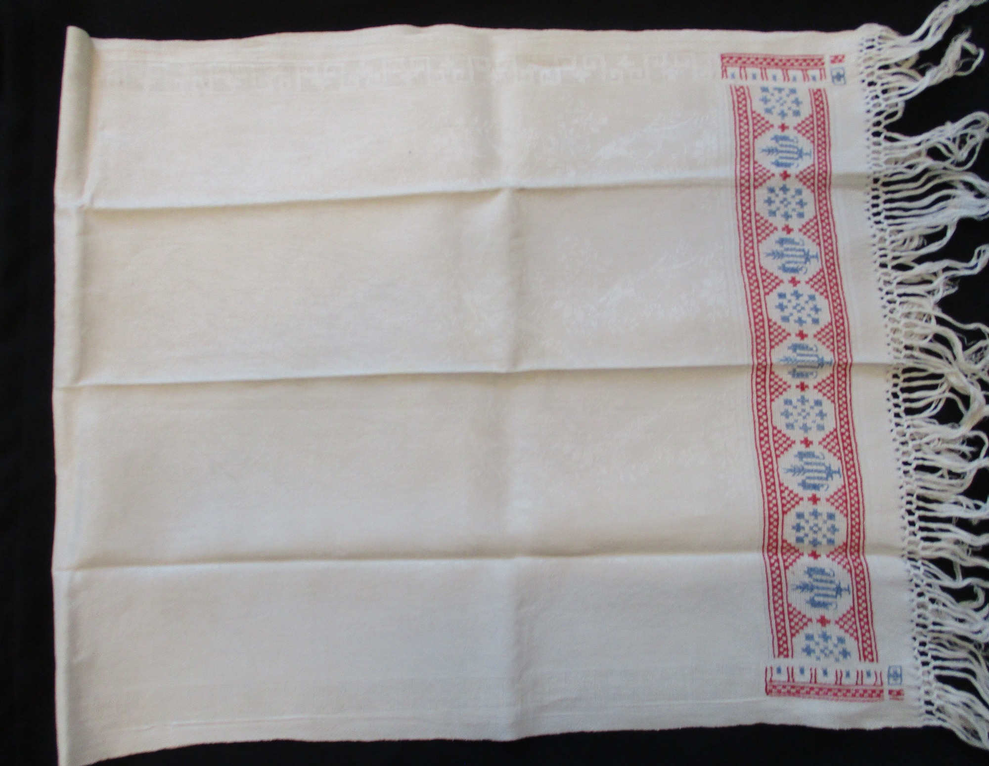 One embroidered damask towel: half folded damask towel View 2