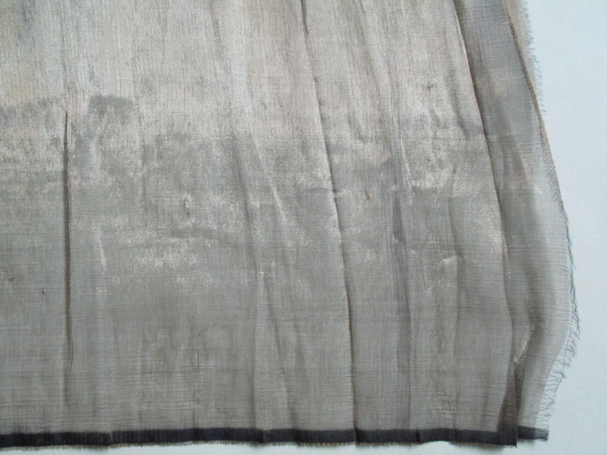 Piece of gold satin material: Corner detail of gold satin material (i)