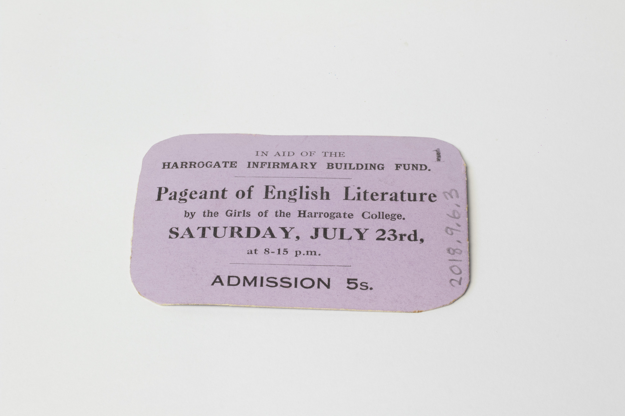 Tin box containing acorns: front view of card