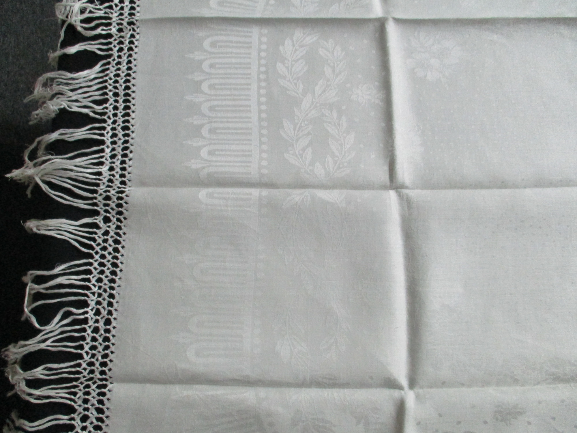 Two fringed damask towels: Detail of damask towel