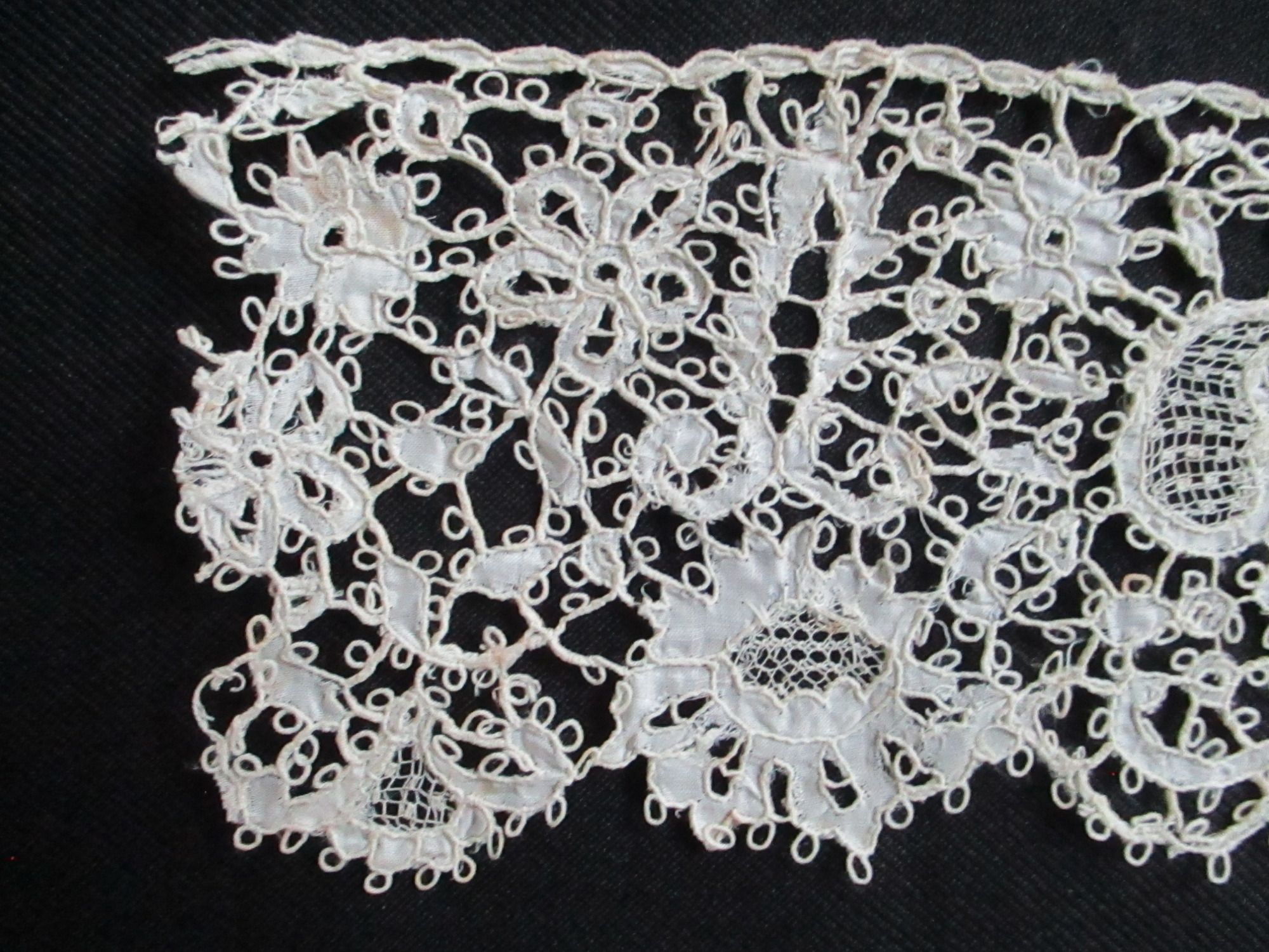 Two pieces of cream silk lace.: Paisley and flower detail on cream silk lace. (iii)