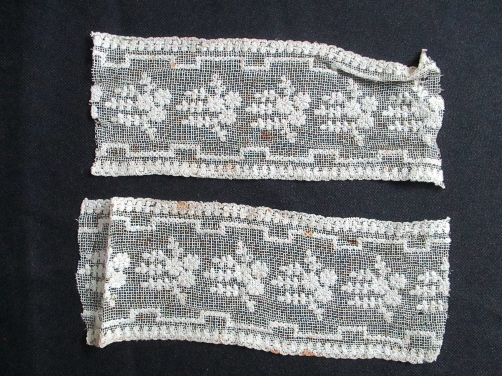 Two pieces of decorated cream netting.: Two pieces of cream lace ribbon. (ii)