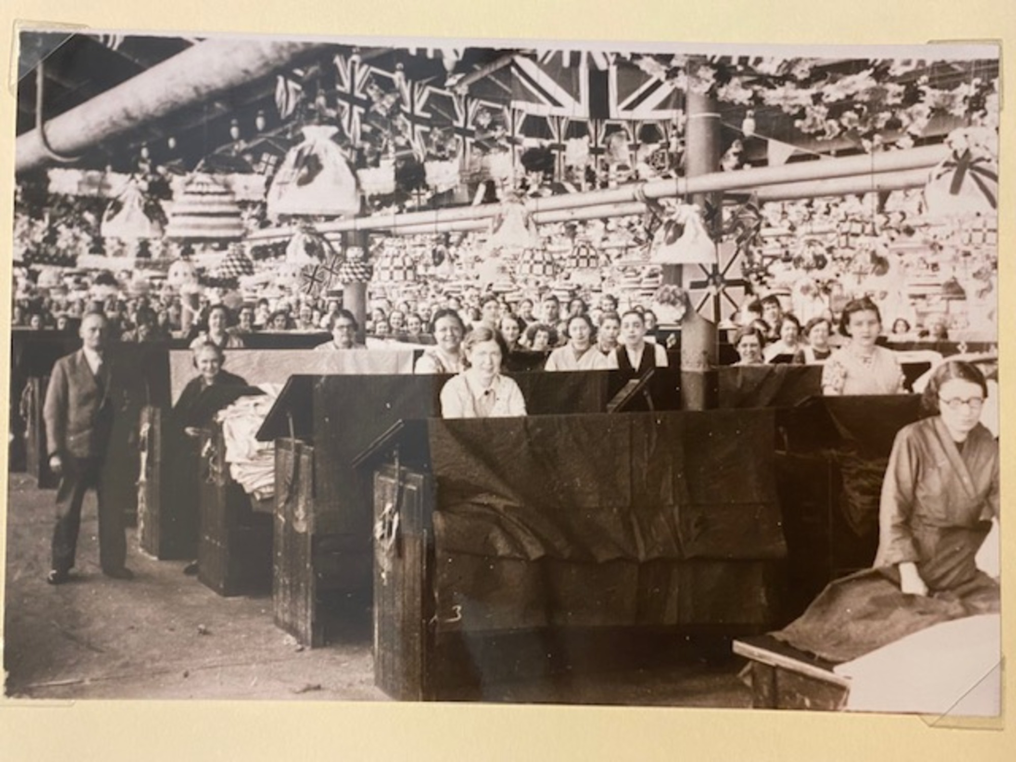 Workers in Salts Mill with room decorated for an event